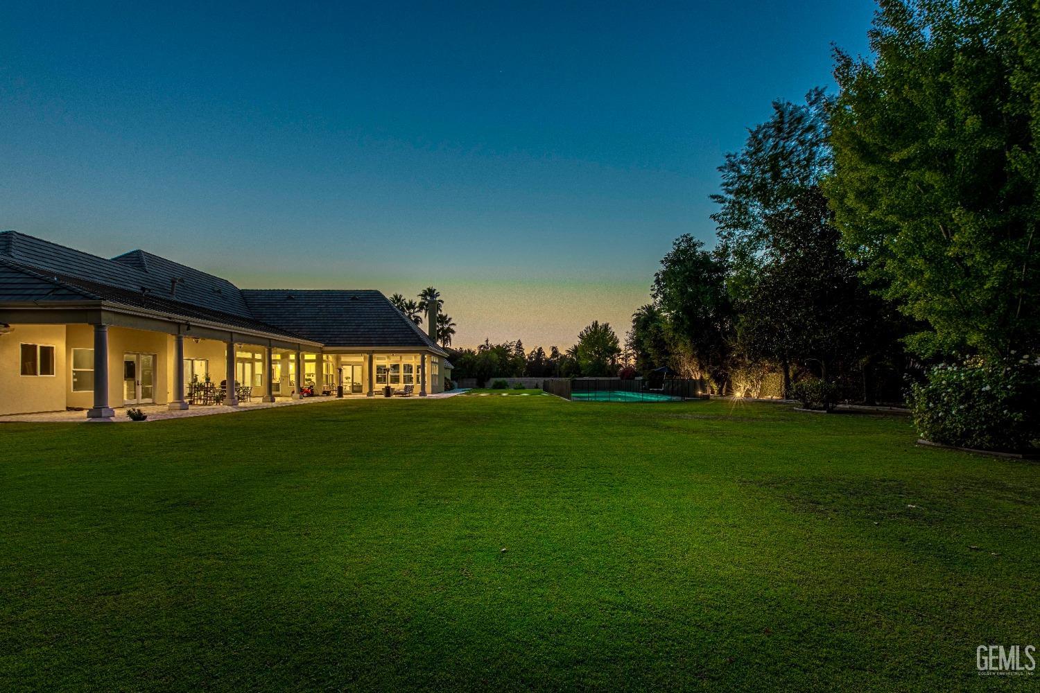 Undisclosed Address Bakersfield, CA 93314 - Photo 73 of 75 a view of yard with swimming pool and green space