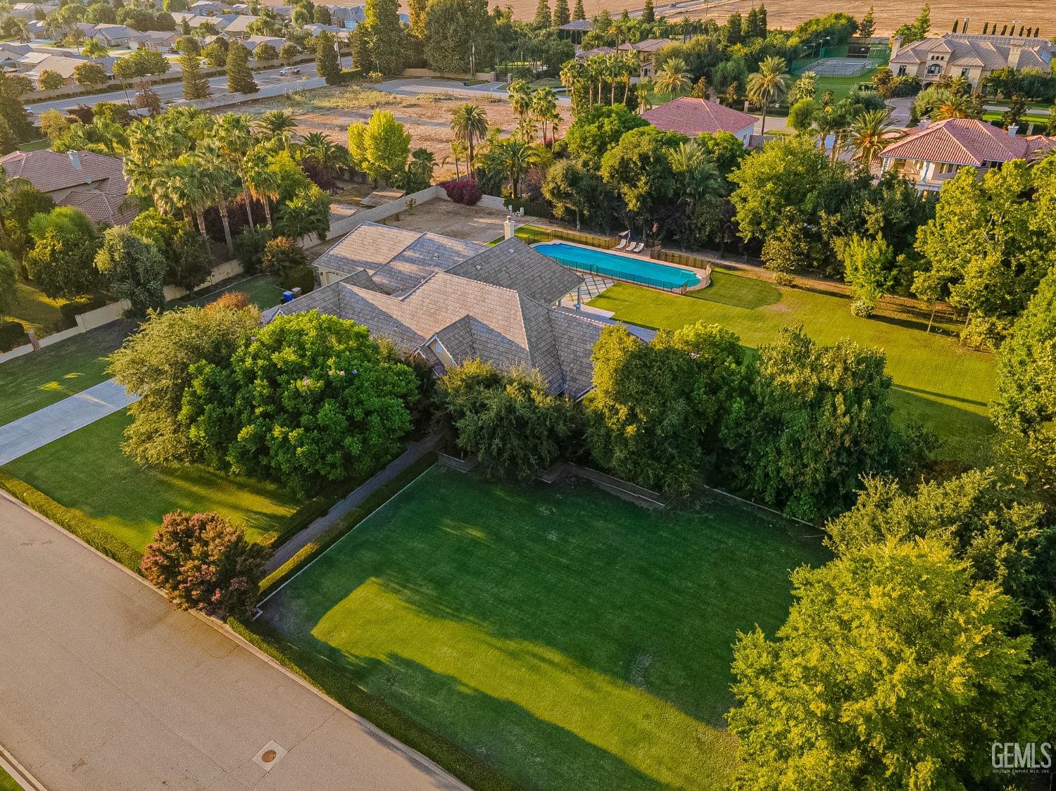 Undisclosed Address Bakersfield, CA 93314 - Photo 74 of 75 an aerial view of residential houses with outdoor space and swimming pool