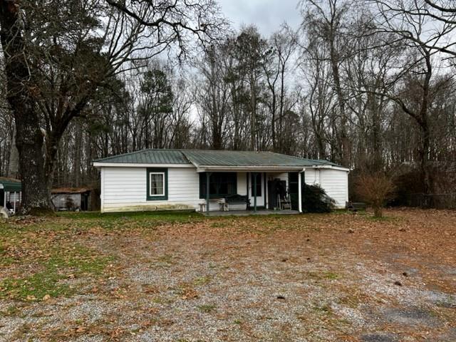 5326 Heardsville Road Cumming, GA 30028 - Photo 1 of 1 a house that has a tree in front of it