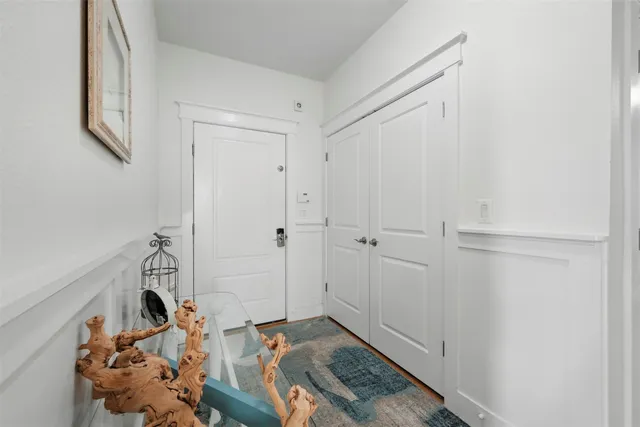 a view of a balcony with furniture and a potted plant