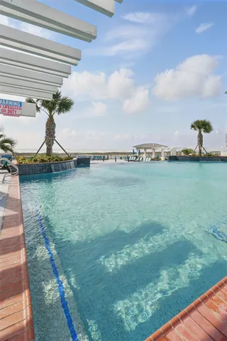 a view of a swimming pool and a chairs