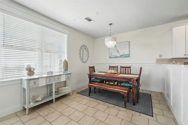 a room with furniture a window and a chandelier