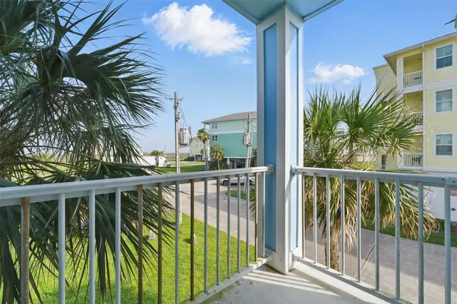 a view of a balcony with plants