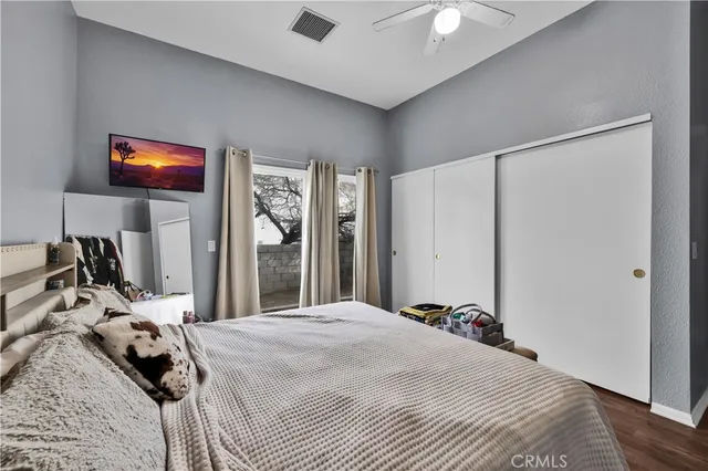 a bedroom with a bed and a walk in closet