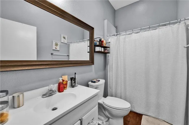 a bedroom with furniture and a chandelier