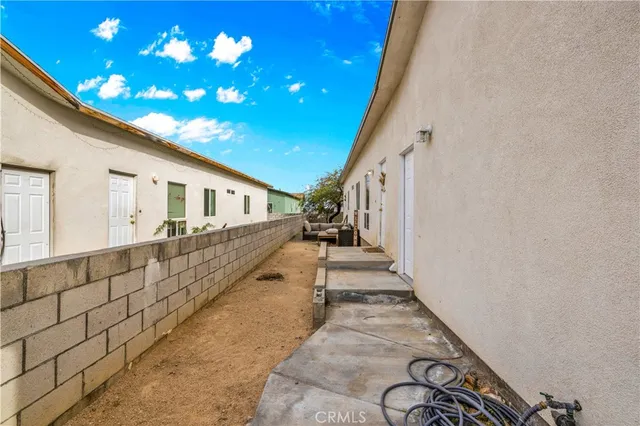 a view of a backyard with a large tree