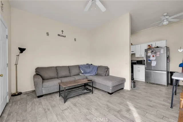 a kitchen with granite countertop a sink stove and cabinets