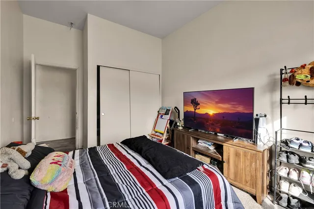 a bed room with a bed and large window