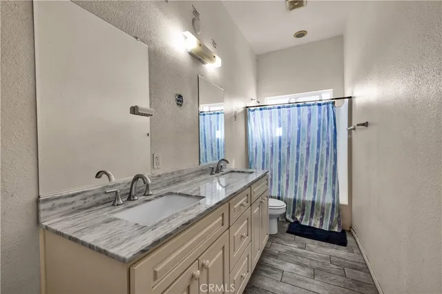 a bedroom with a bed and a lamp