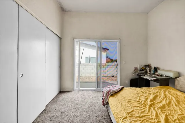 a view of a building with mountains in the background