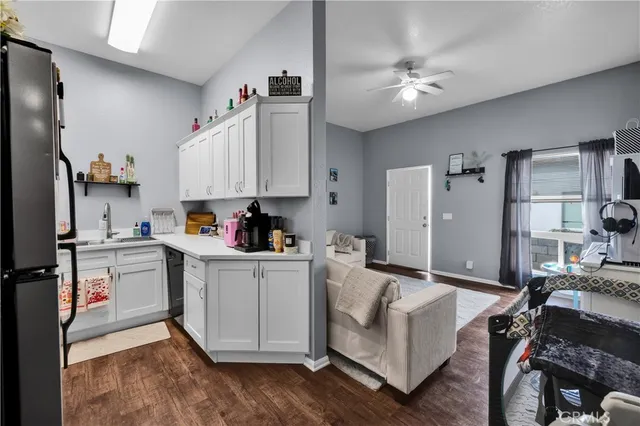 a kitchen with stainless steel appliances granite countertop a stove and a refrigerator