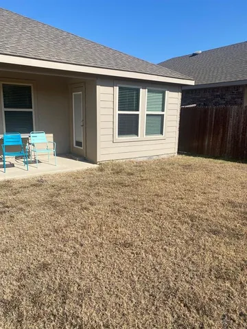 a house with yard in front of it