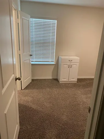 a view of a room that has a window in it