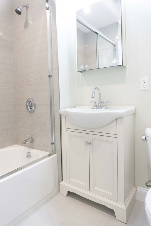 41 West Walnut Park Boston, MA 02119 - Photo 19 of 30 a bathroom with a sink a vanity and a mirror