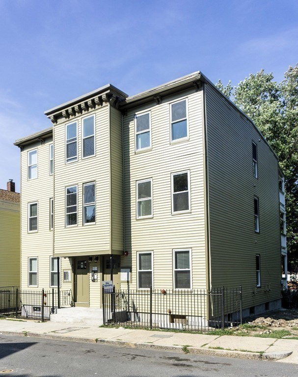 41 West Walnut Park Boston, MA 02119 - Photo 25 of 30 a front view of a house with a yard
