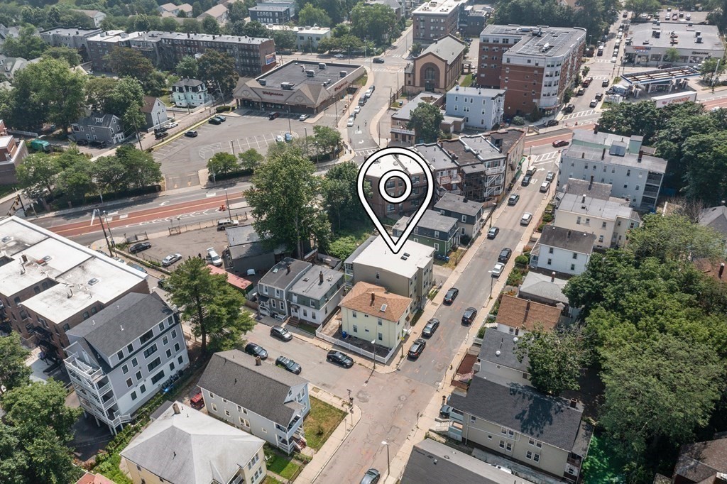 41 West Walnut Park Boston, MA 02119 - Photo 27 of 30 an aerial view of multiple houses with yard