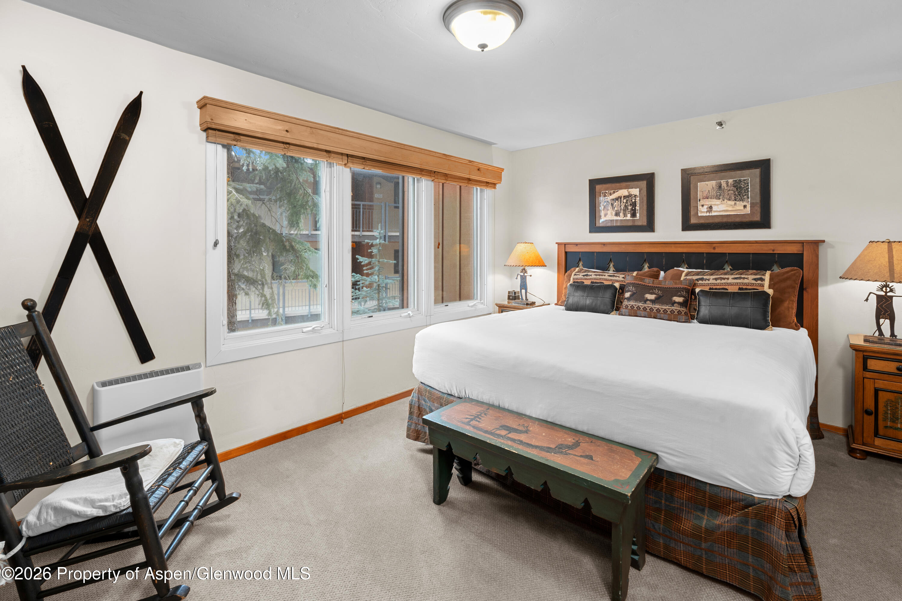 400 Wood Road, Unit 2111H Snowmass Village, CO 81615 - Photo 7 of 16 a bed sitting in a bedroom next to a window