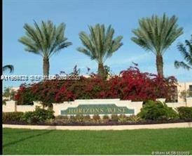 8520 Southwest 133rd Avenue Road, Unit 408 Miami, FL 33183 - Photo 2 of 10 a view of a house with a garden