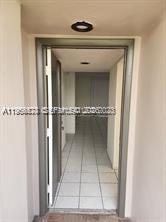8520 Southwest 133rd Avenue Road, Unit 408 Miami, FL 33183 - Photo 9 of 10 a view of a wooden door