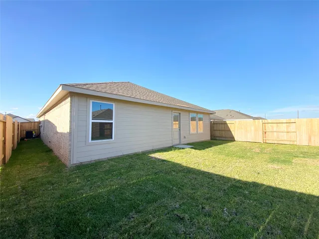 a house view with a backyard space