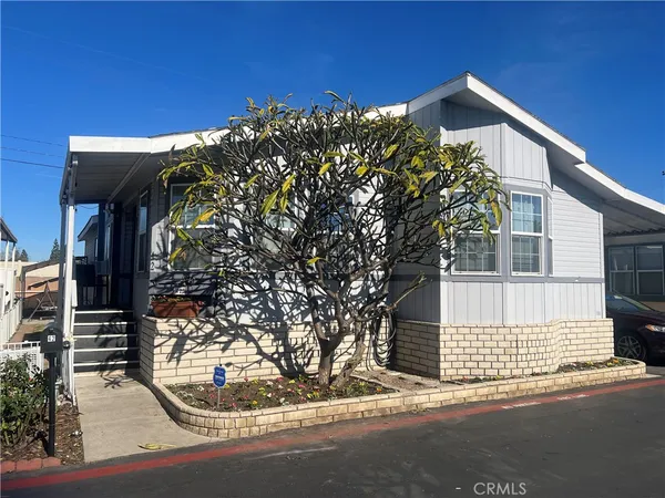 a view of a house with a tree