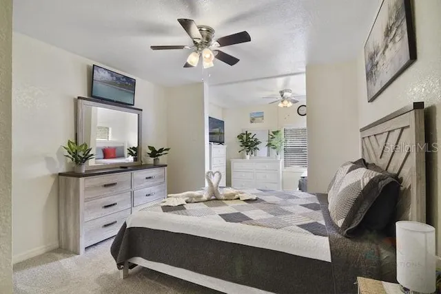 a bed room with a bed window and a mirror