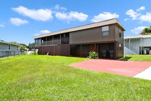 a front view of house with yard and green space