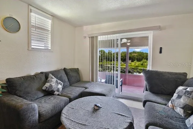 a living room with furniture and a window