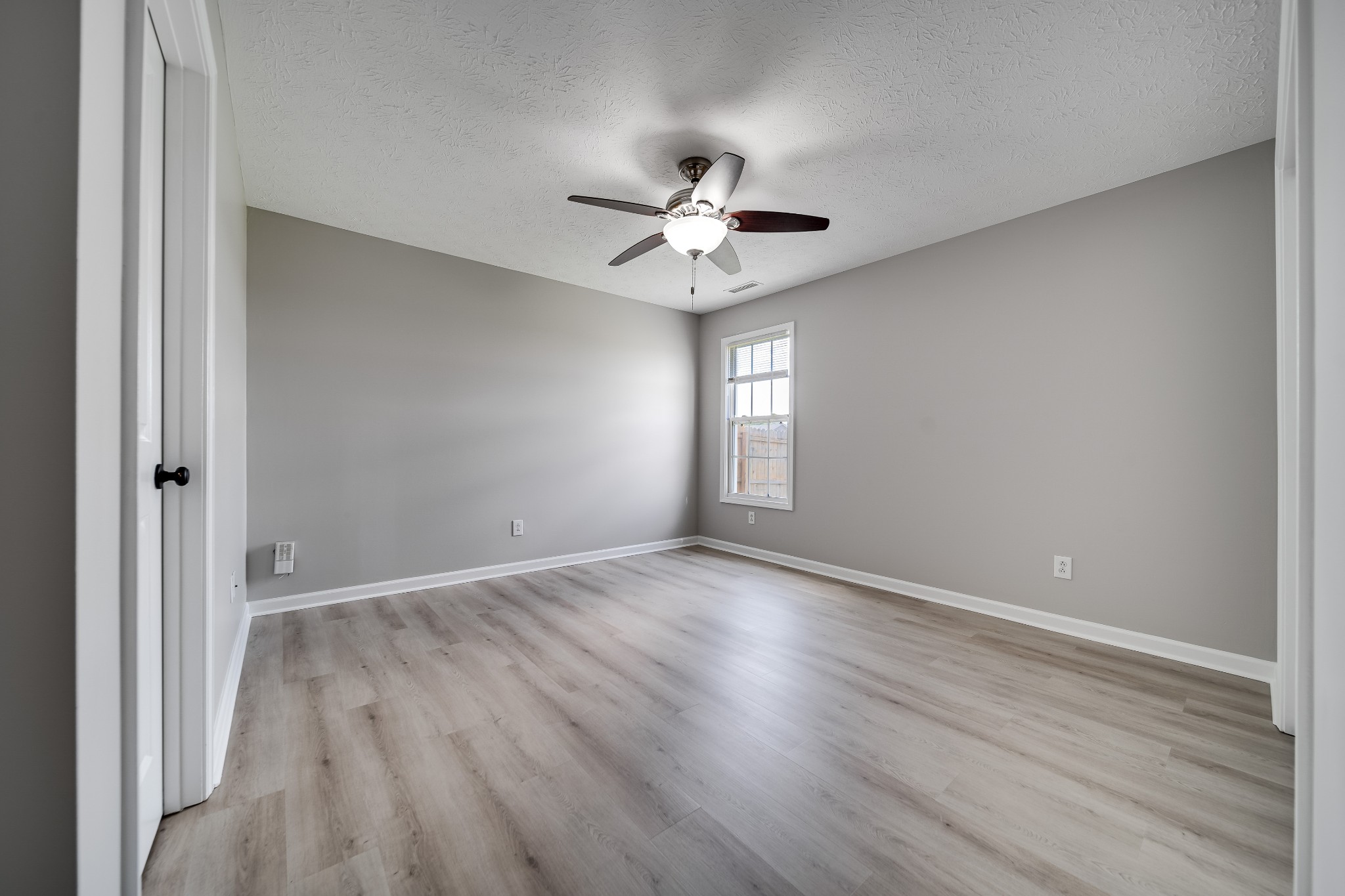 630 Berry Circle Springfield, TN 37172 - Photo 21 of 46 wooden floor in an empty room with a window