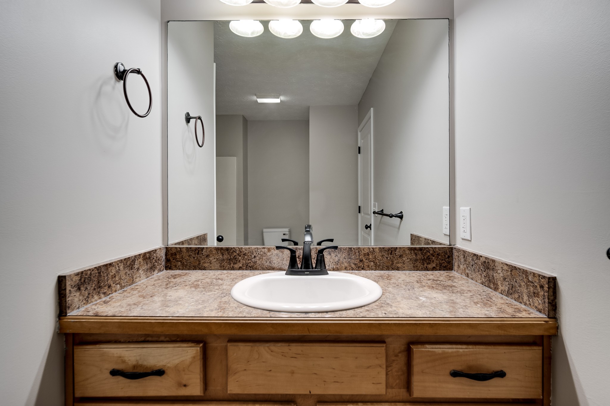 630 Berry Circle Springfield, TN 37172 - Photo 24 of 46 a bathroom with a granite countertop sink a mirror and shower