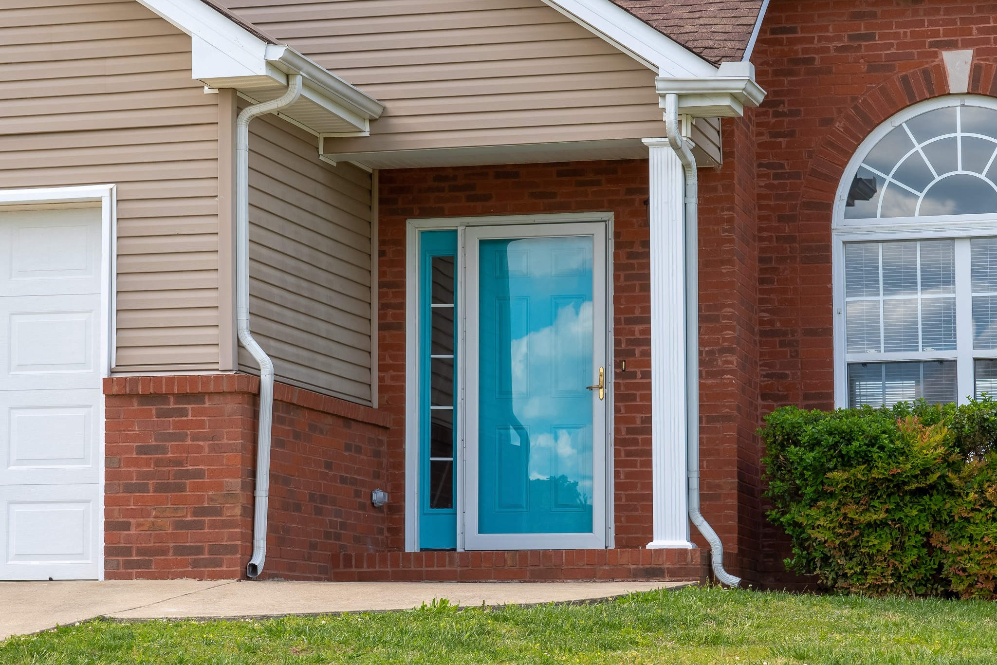 630 Berry Circle Springfield, TN 37172 - Photo 3 of 46 a view of a brick house with a yard and plants