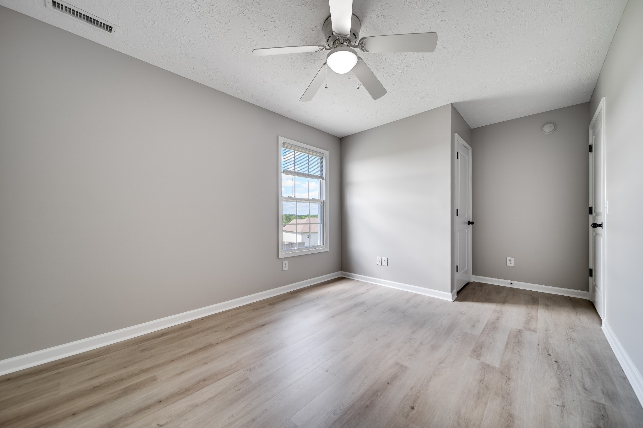 630 Berry Circle Springfield, TN 37172 - Photo 31 of 46 wooden floor in an empty room with a window