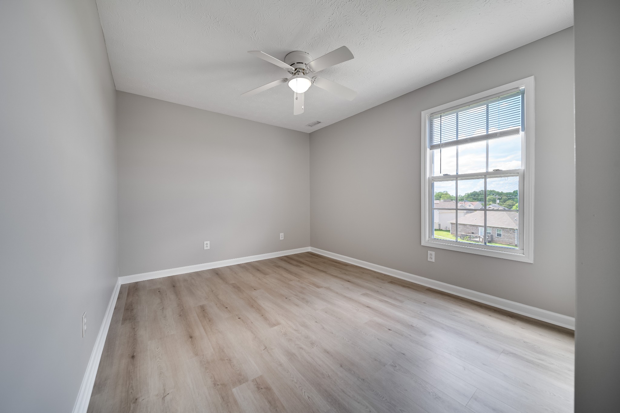 630 Berry Circle Springfield, TN 37172 - Photo 35 of 46 an empty room with wooden floor and windows