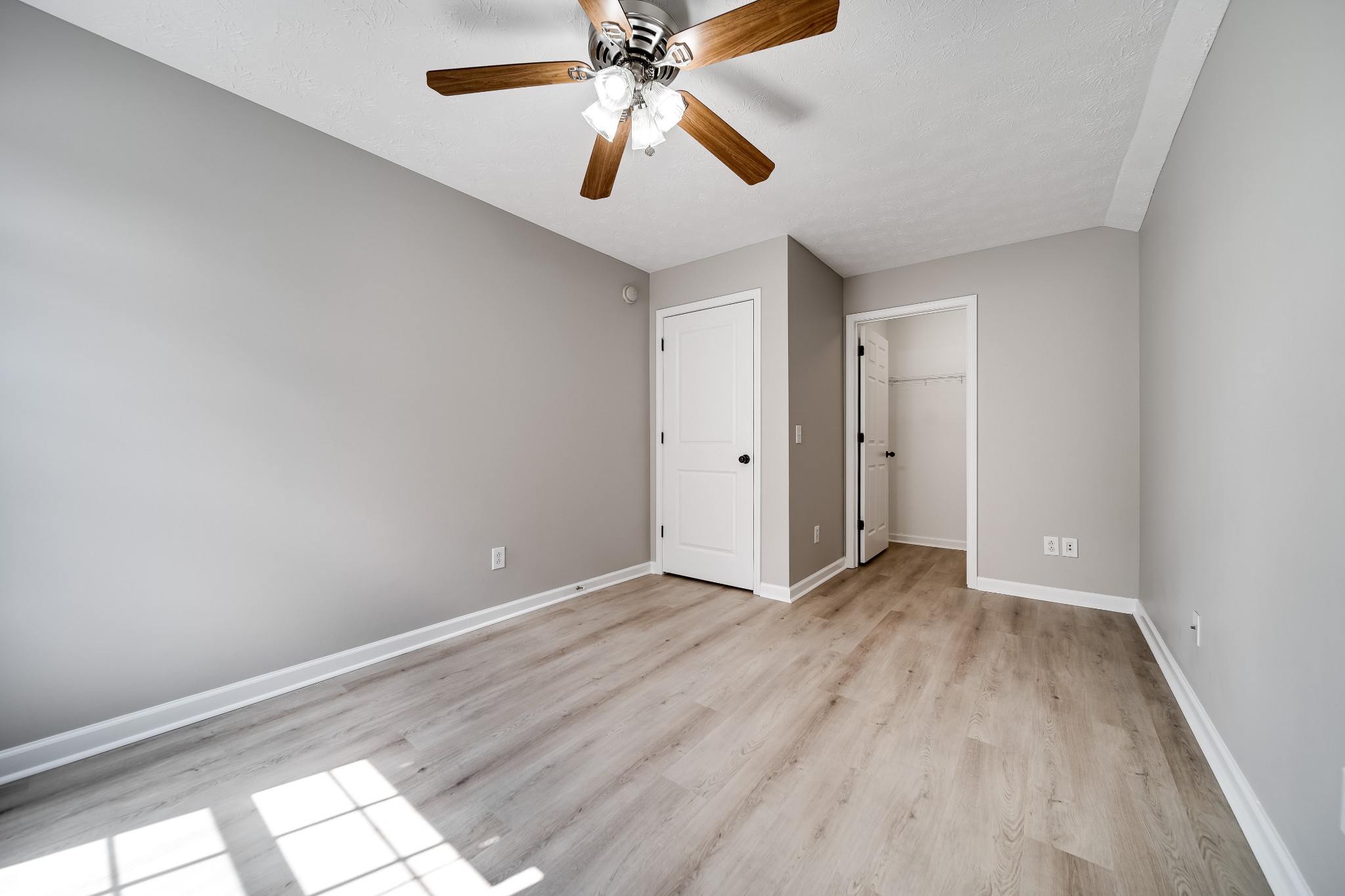 630 Berry Circle Springfield, TN 37172 - Photo 37 of 46 an empty room with wooden floor closet and ceiling fan
