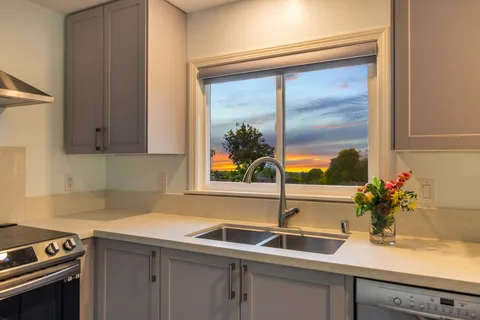 a kitchen with a sink and a window