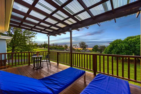 a view of a balcony with furniture