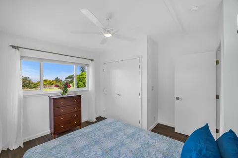 a room with a dresser and a window