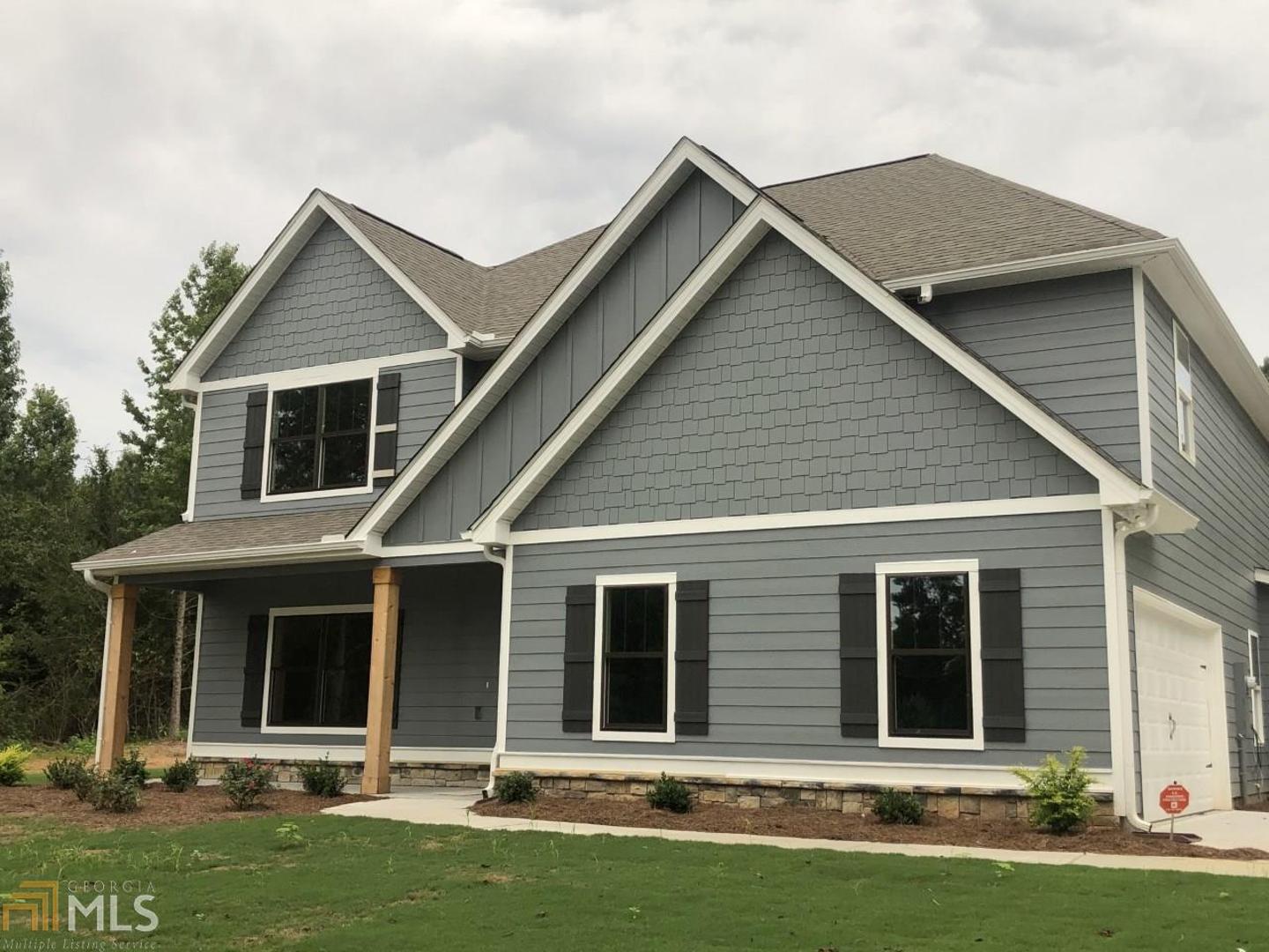 109 Robin Road, Unit 15 Brooks, GA 30205 - Photo 1 of 1 front view of a house with a yard