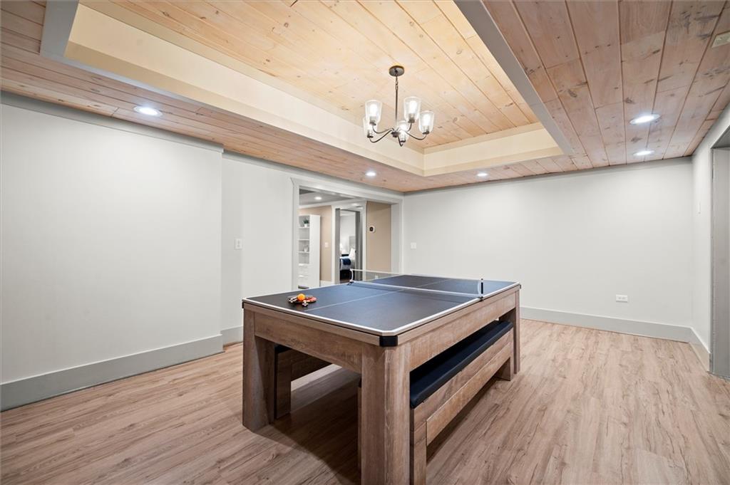 6229 Grand Loop Road Sugar Hill, GA 30518 - Photo 64 of 93 a room with pool table and wooden floor