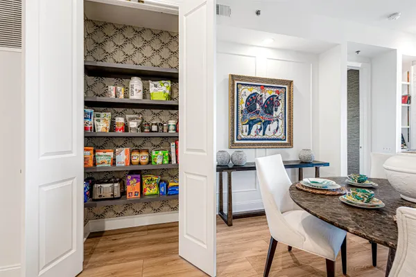 a kitchen with stainless steel appliances a sink and a refrigerator