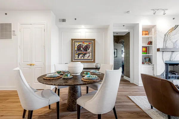 a dining room with furniture and window