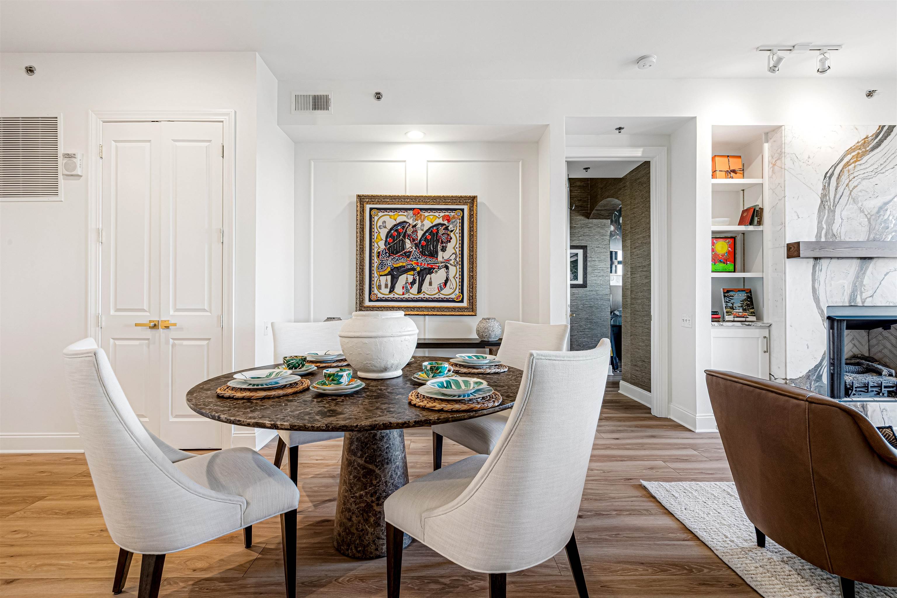 717 Riverside Drive, Unit 1205 Memphis, TN 38103 - Photo 2 of 33 Dining space featuring built in features, a fireplace, and light wood-style floors