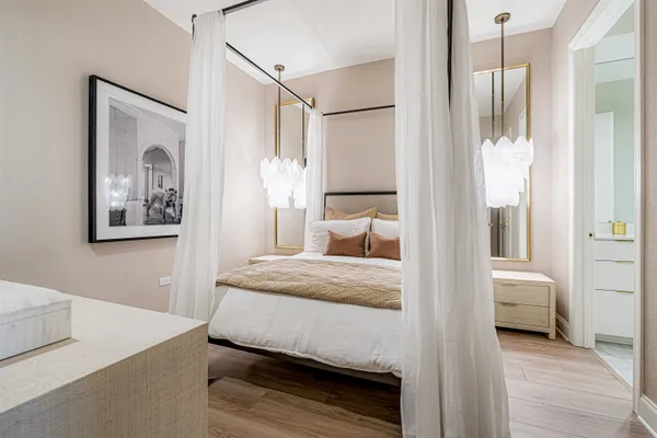 a bedroom with a bed and a view of bathroom