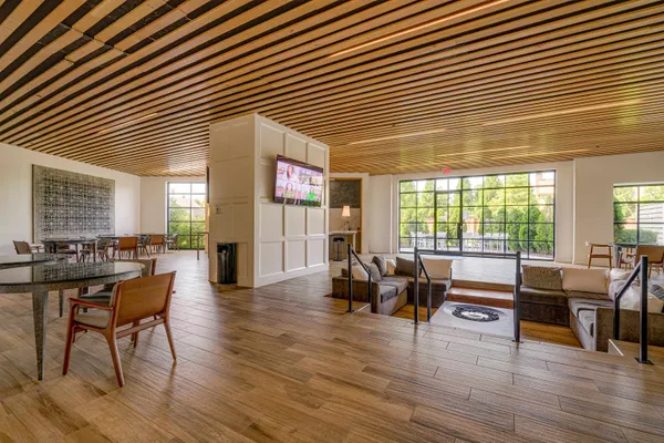 a living room with furniture and wooden floor