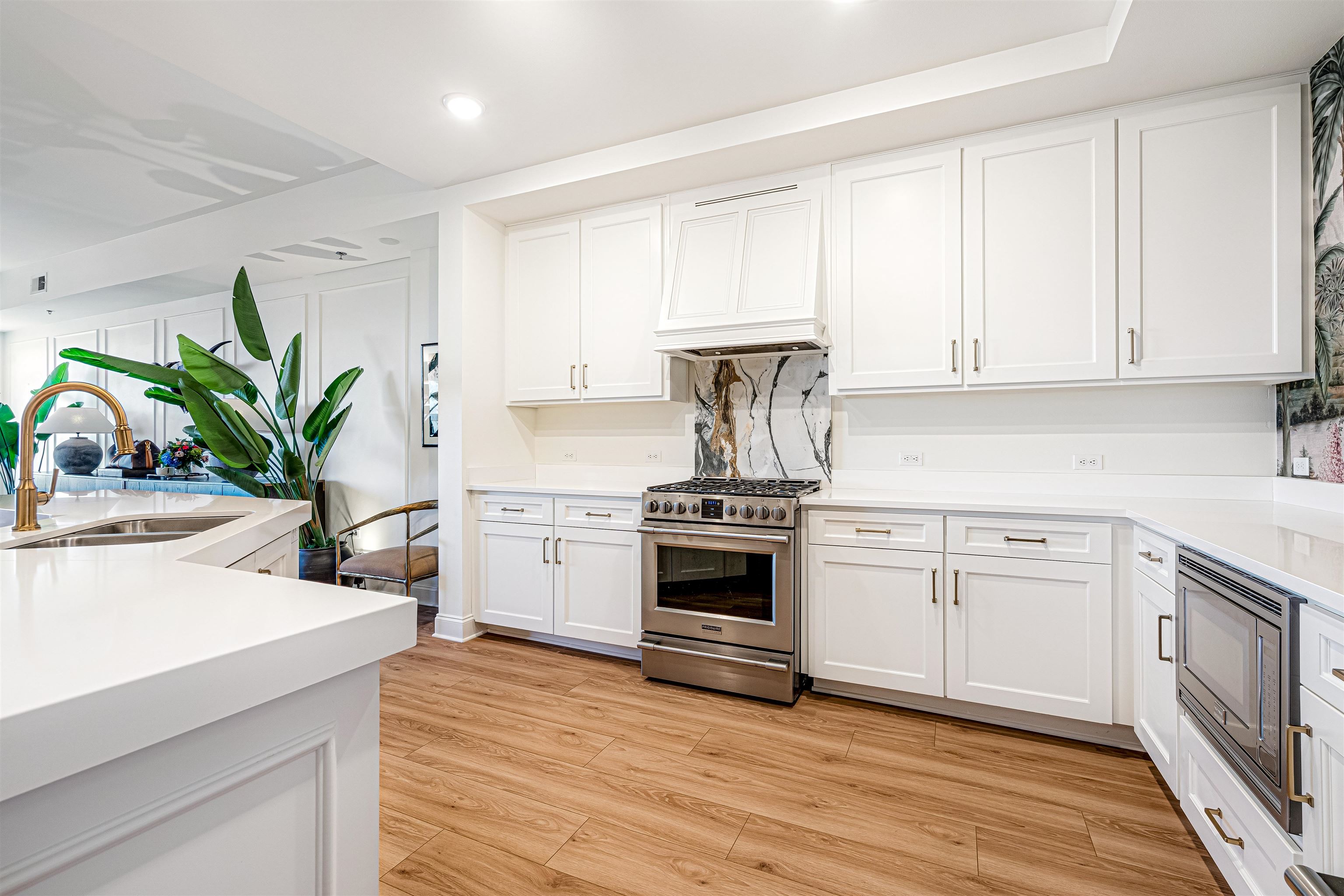 717 Riverside Drive, Unit 1205 Memphis, TN 38103 - Photo 30 of 33 a kitchen with a white stove top oven and white cabinets