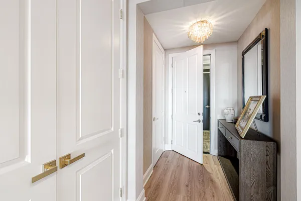 a view of a hallway view with furniture and a hallway