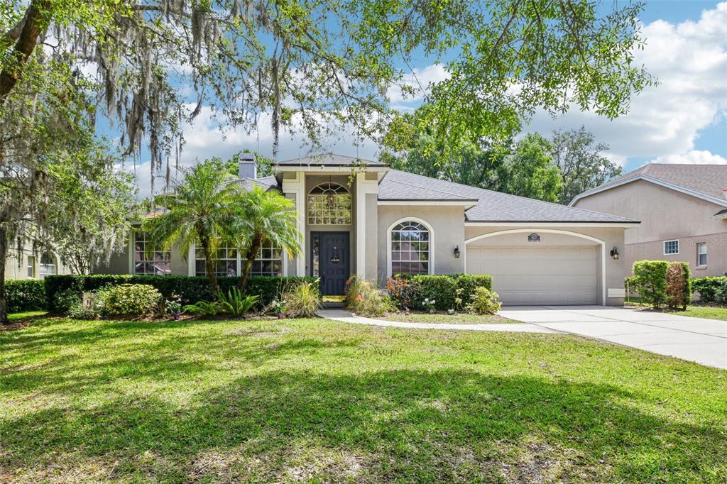917 Keep Way Loop Oviedo, FL 32765 - Photo 1 of 1 a front view of a house with a yard and garage