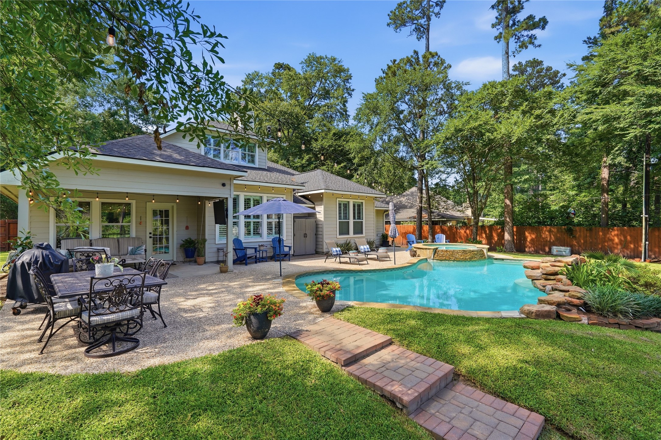 2408 Hollowbrook Lane Conroe, TX 77384 - Photo 38 of 49 This beautiful space is set on nearly 1/2 acre lot. Plenty of space to garden, enjoy the pool, and the amazing back yard oasis!
