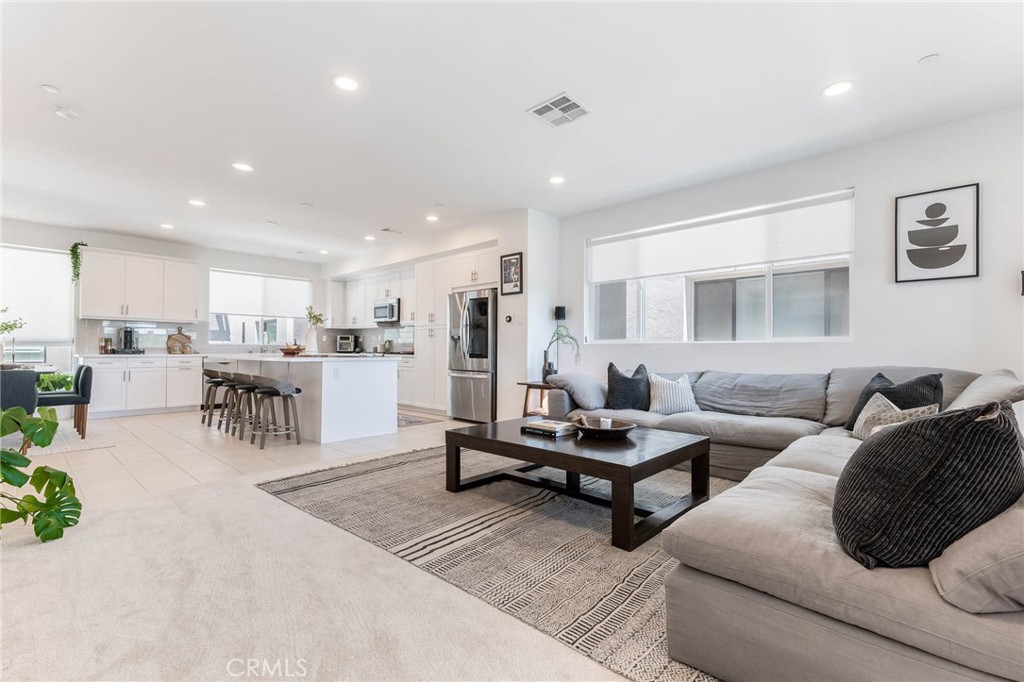13161 Victory Boulevard Valley Glen, CA 91401 - Photo 1 of 33 a living room with furniture and kitchen view