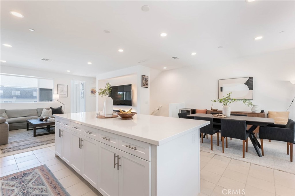 13161 Victory Boulevard Valley Glen, CA 91401 - Photo 13 of 33 a kitchen with a sink a stove and chairs